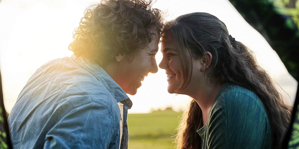 man and woman smiling at each other