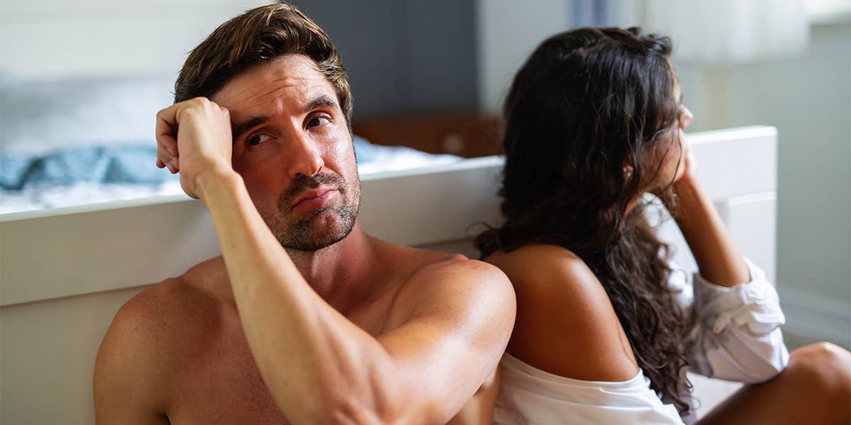9 Signs Your Relationship Isn't Just Failing — It's Already Over unhappy couple in bedroom