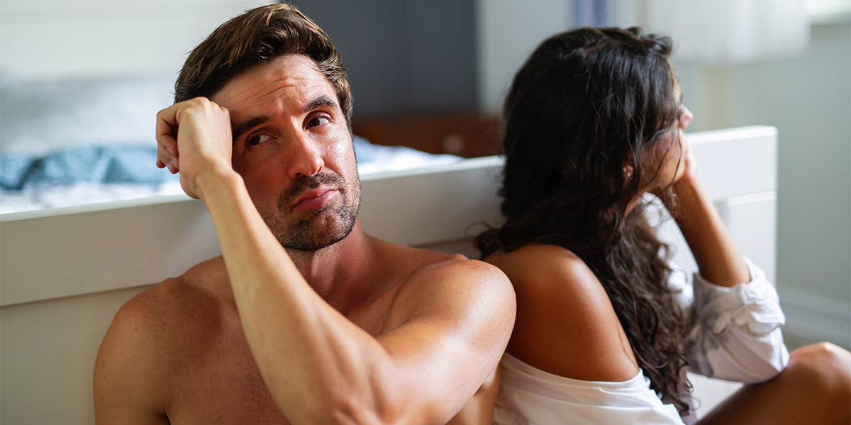 unhappy couple in bedroom