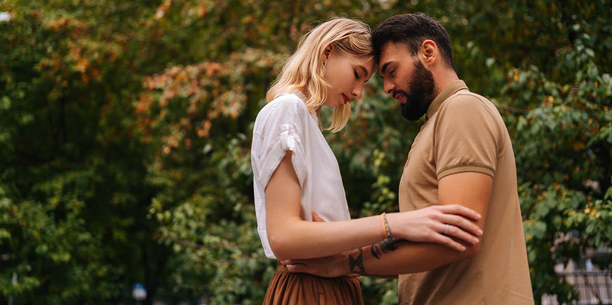 Signs You’re In Love With A Man, Not A Boy couple embracing