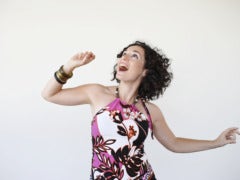 7 Things You Must Do Before A First Date woman dancing before a first date