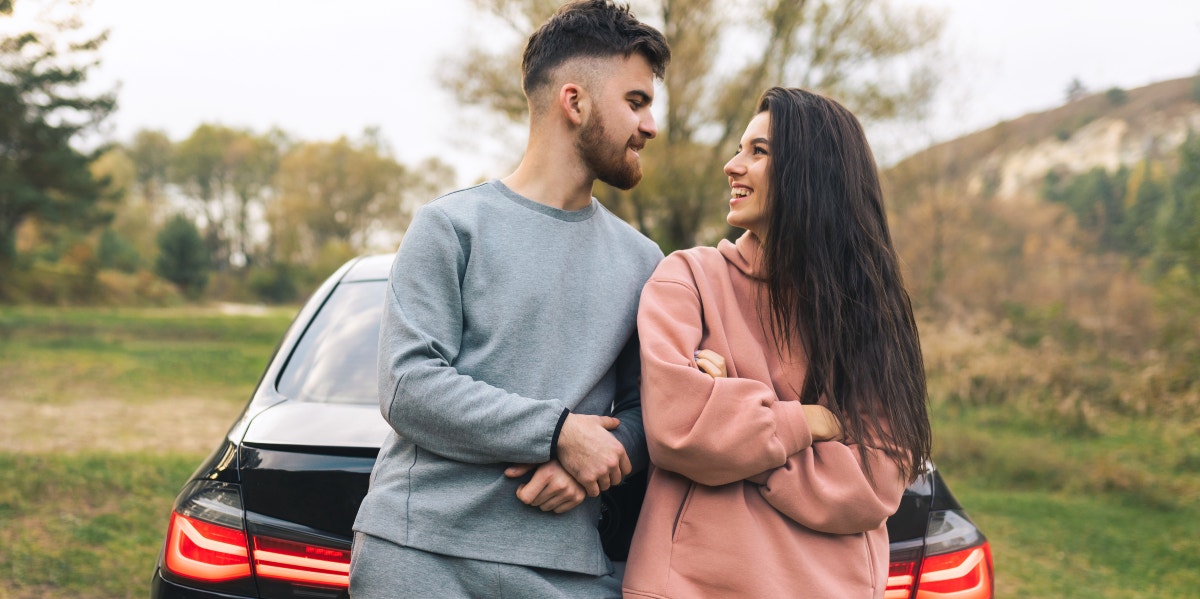 friends with benefits leaning on car