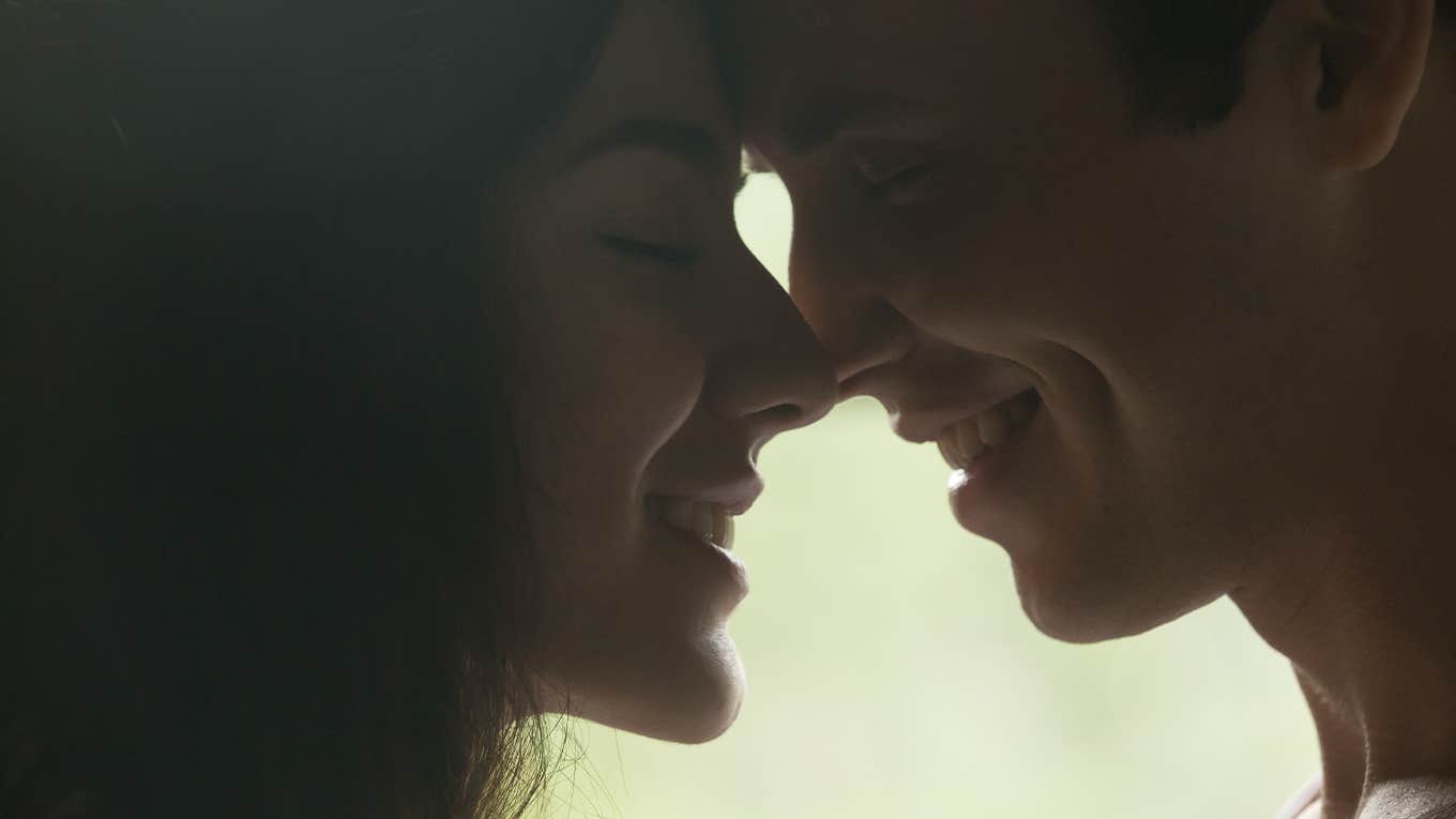 Steps To Help You Attract Your Soulmate Loving man and woman getting closer to kiss each other