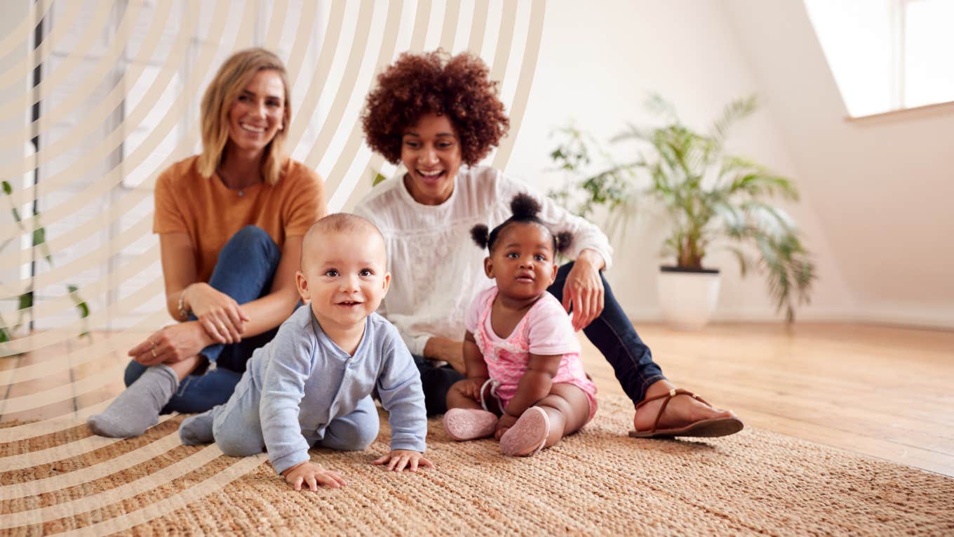 moms talking, watching their babies play