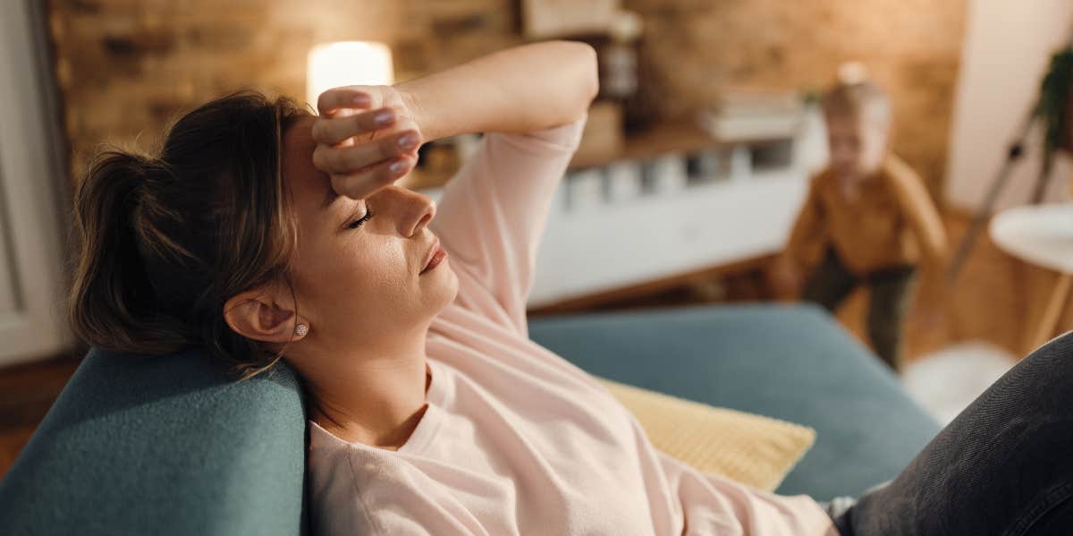 Don't Confuse Burnout With Worn Out mom tired on couch