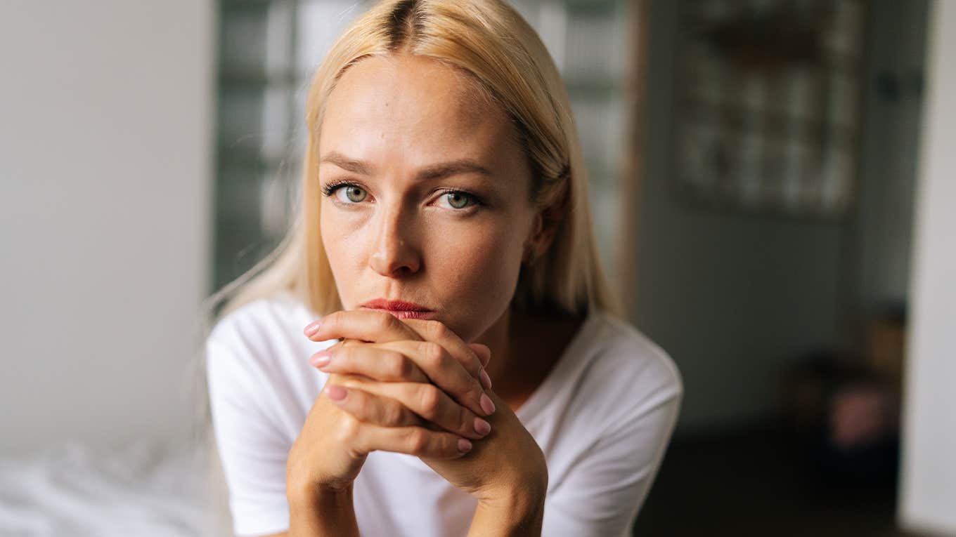 5 Little Things A Gaslighter Will Say To Make You Feel 'Crazy' Close up face of thoughtful blonde