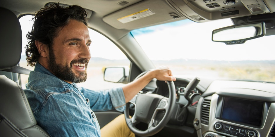 man in car driving