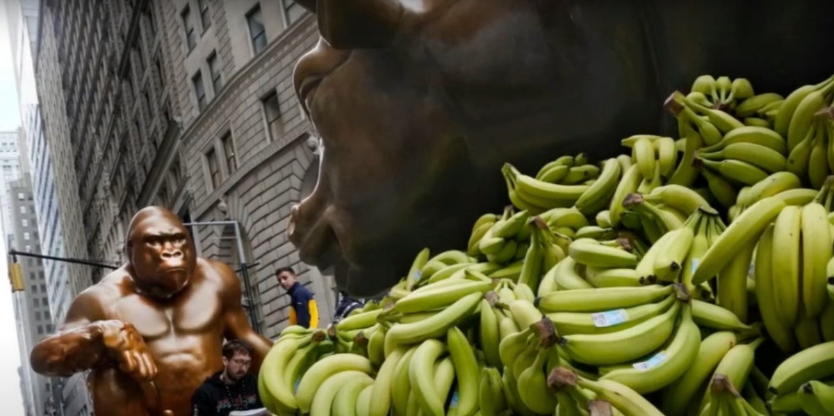 The Meaning Behind The Harambe Statue On Wall Street Pile Of Bananas Under Charging Bull Statue And Harambe Statue