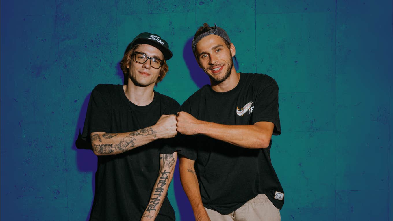 Two men fist bump
