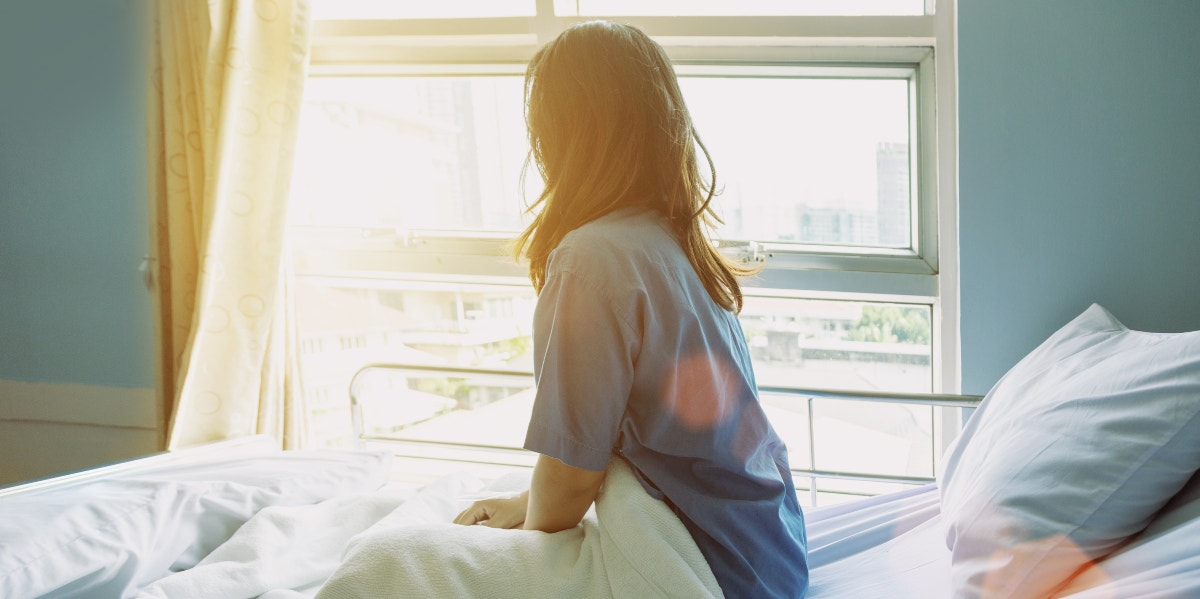 Woman in hospital bed