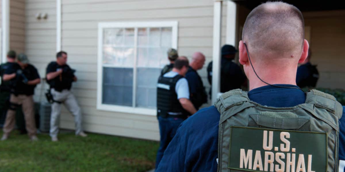 US Marshals entering building