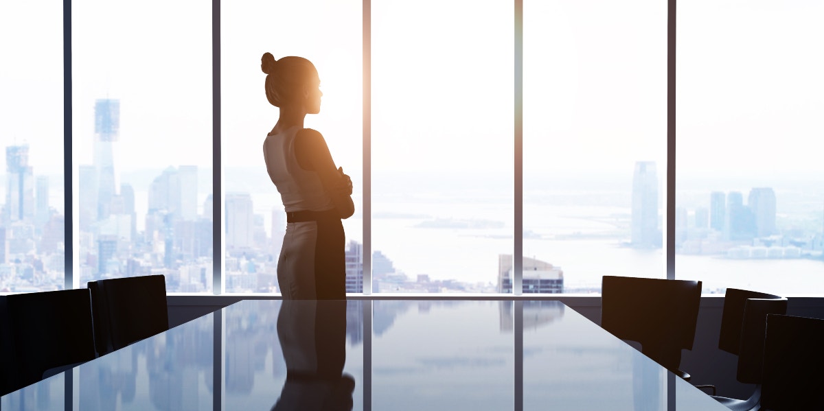 Woman standing in front of window