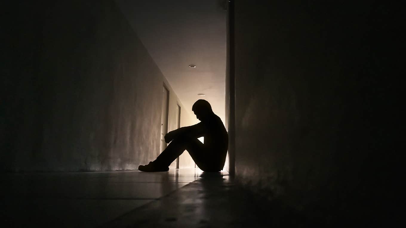 Silhouette of depressed man