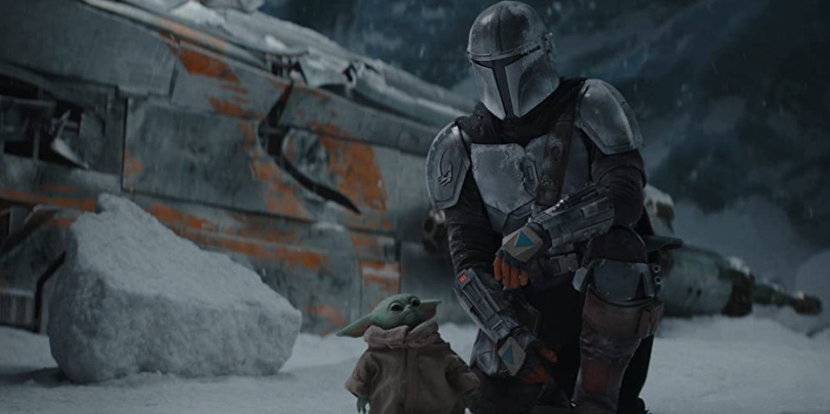 Scene from "The Mandalorian" of Mando and Grogu