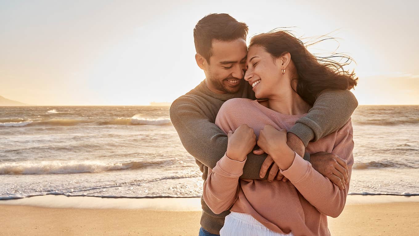 couple having fun at the beach together