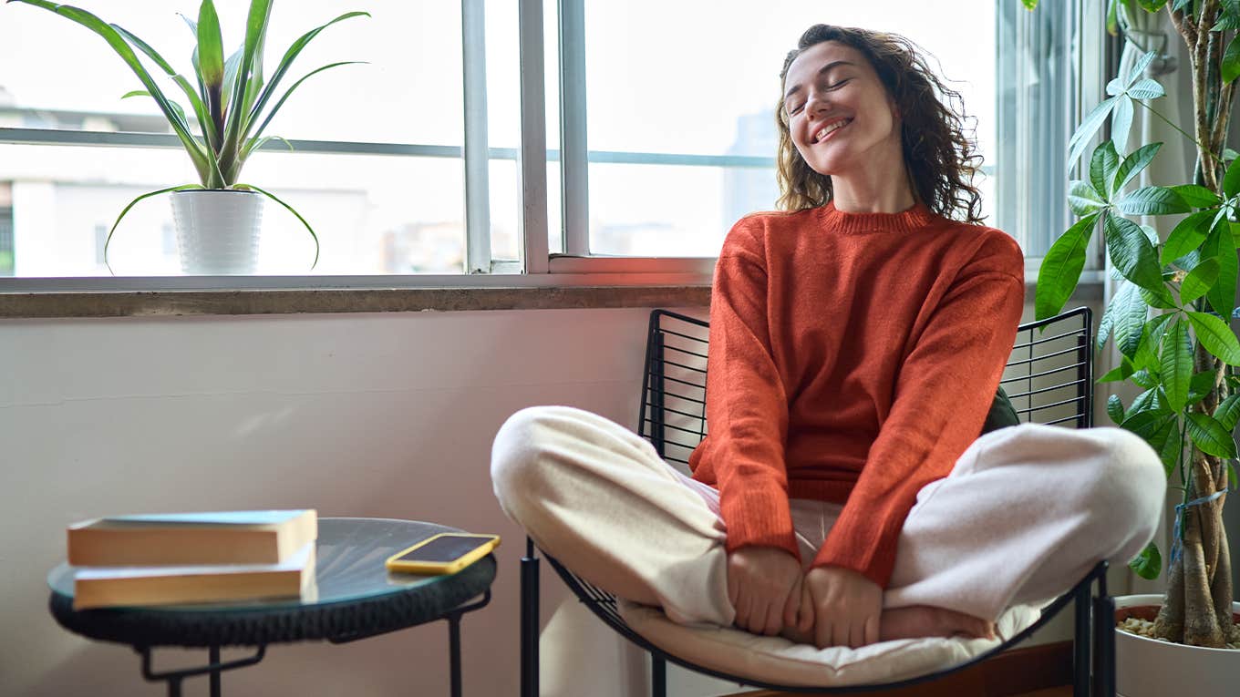 12 Little Things People With Amazing Lives Say To Themselves Daily Young relaxed smiling pretty woman relaxing sitting on chair at home.