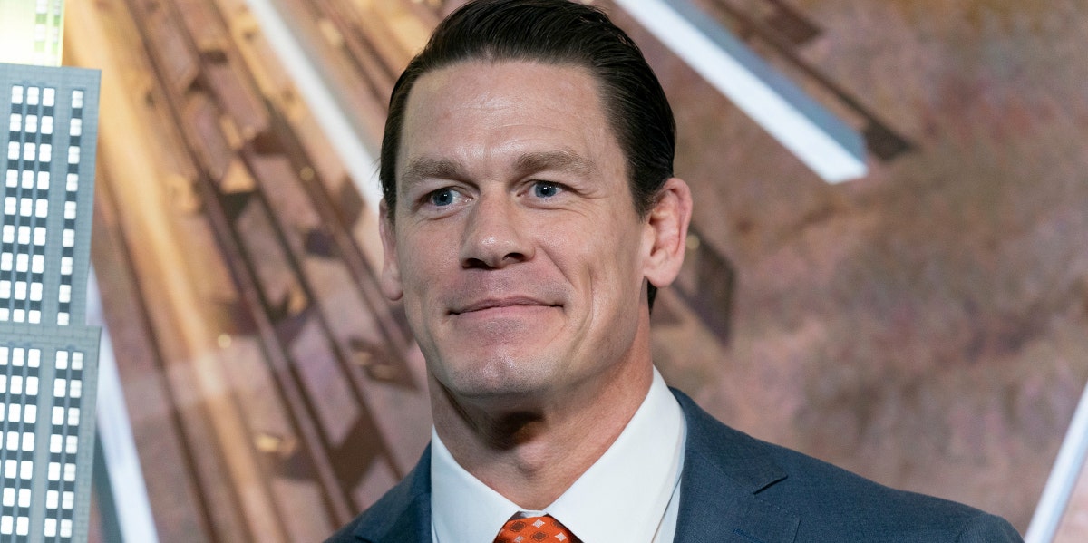 Why John Cena Apologized to China in Mandarin John Cena in a suit
