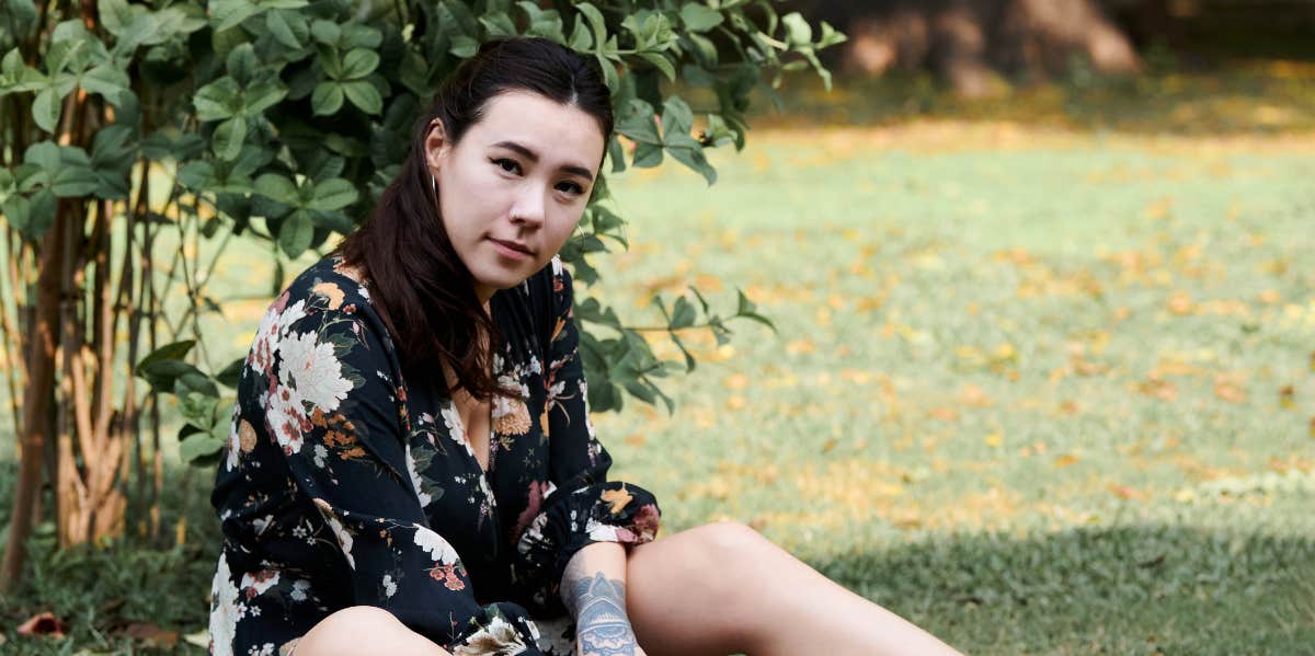 woman sitting on grass