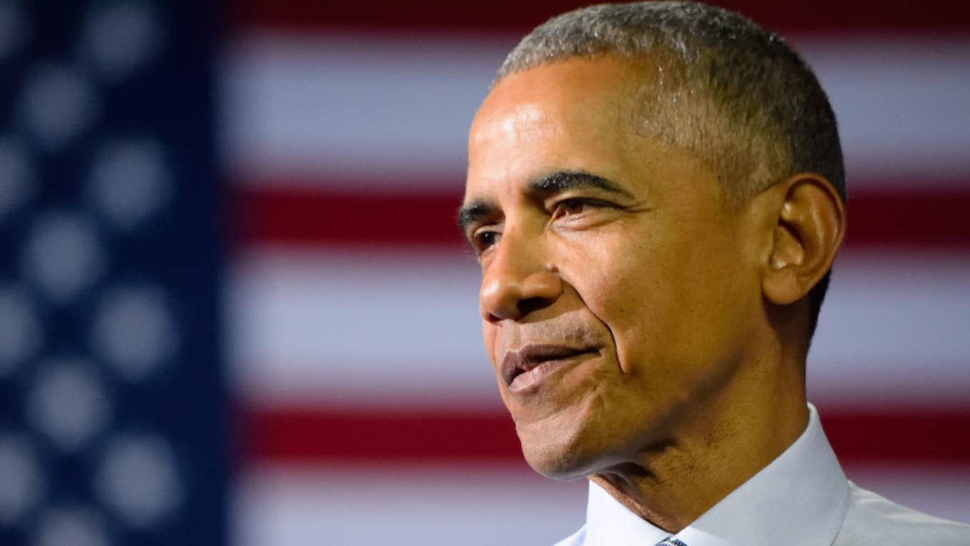 Former President Obama in front of flag