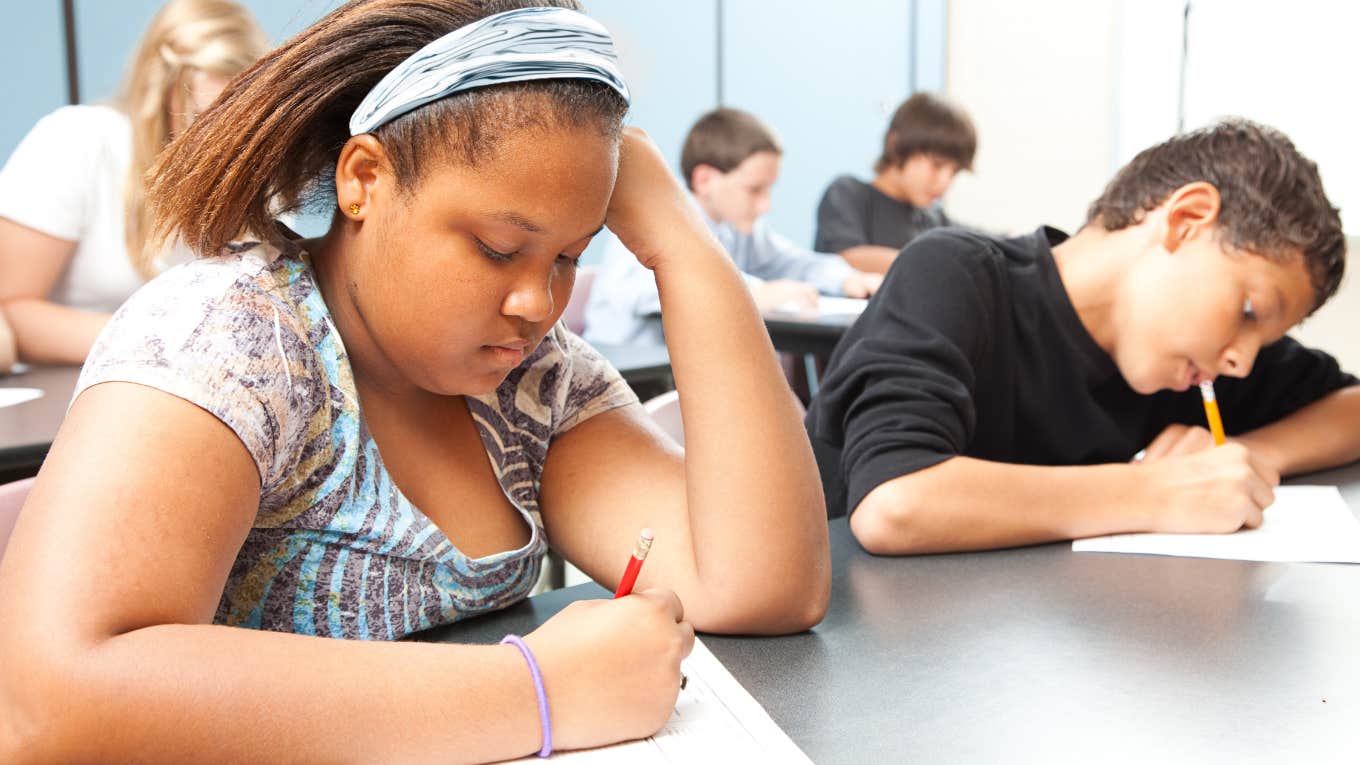 classroom of middle school students working on assignment