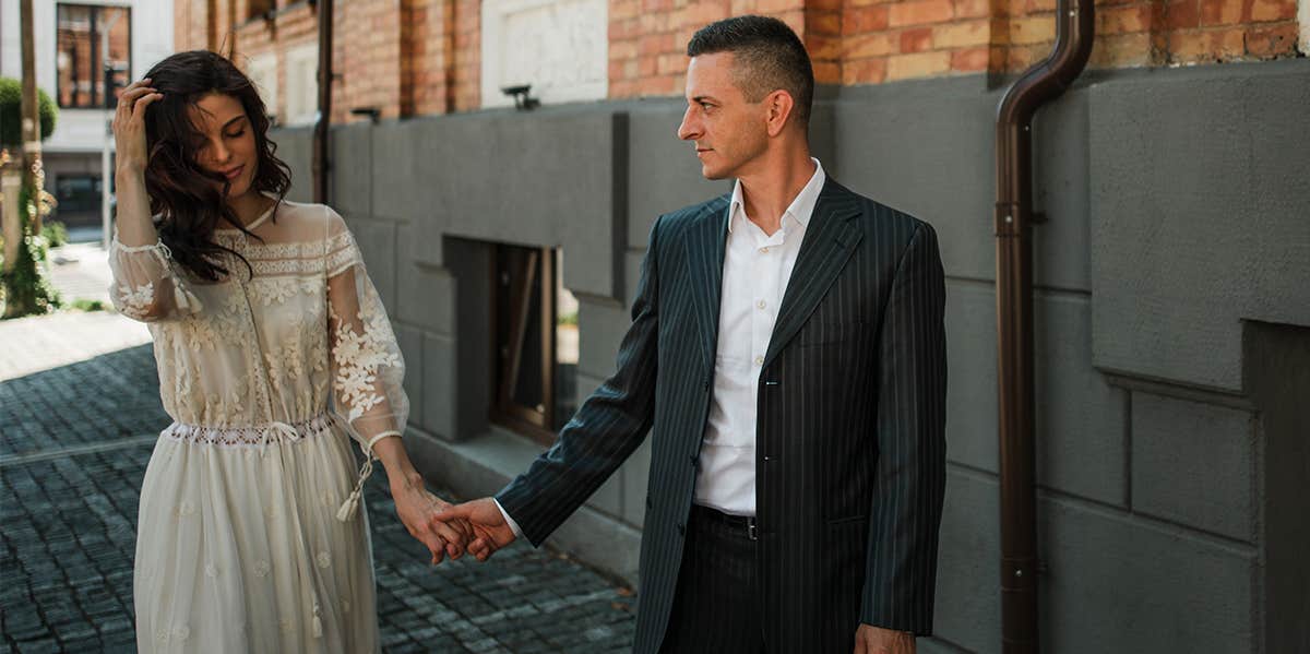 Type-A Married To A Type-B — The Strange Way We Make It Work couple holding hands