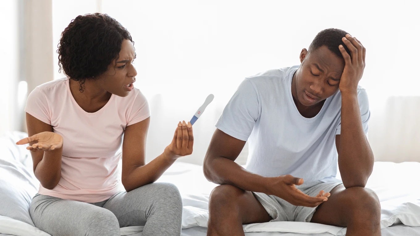 Woman Cuts Her Husband Off From Physical Activity After She Gets Pregnant A Second Time Couple angry while looking at pregnancy test