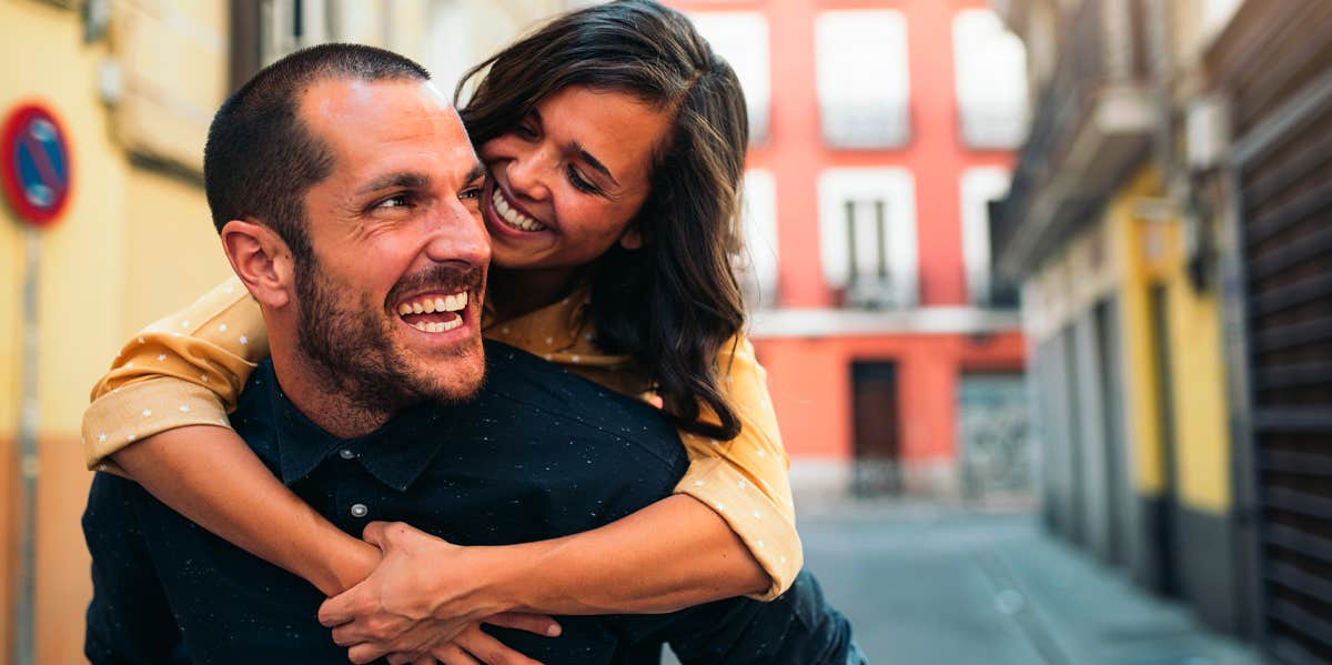 Abortion is Legal Here In New Zealand — Why We're Booking A Vasectomy Anyway couple hug and smile