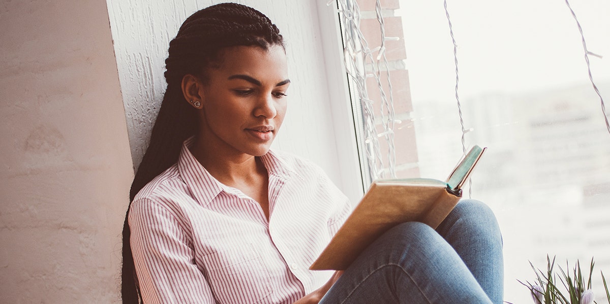 Young Black woman reading Young Black woman reading
