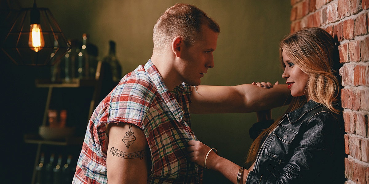 How Almost Having An Affair Saved My Marriage couple leaning against a wall