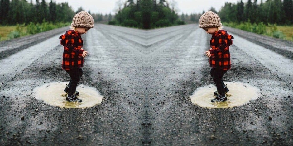 kid in puddle