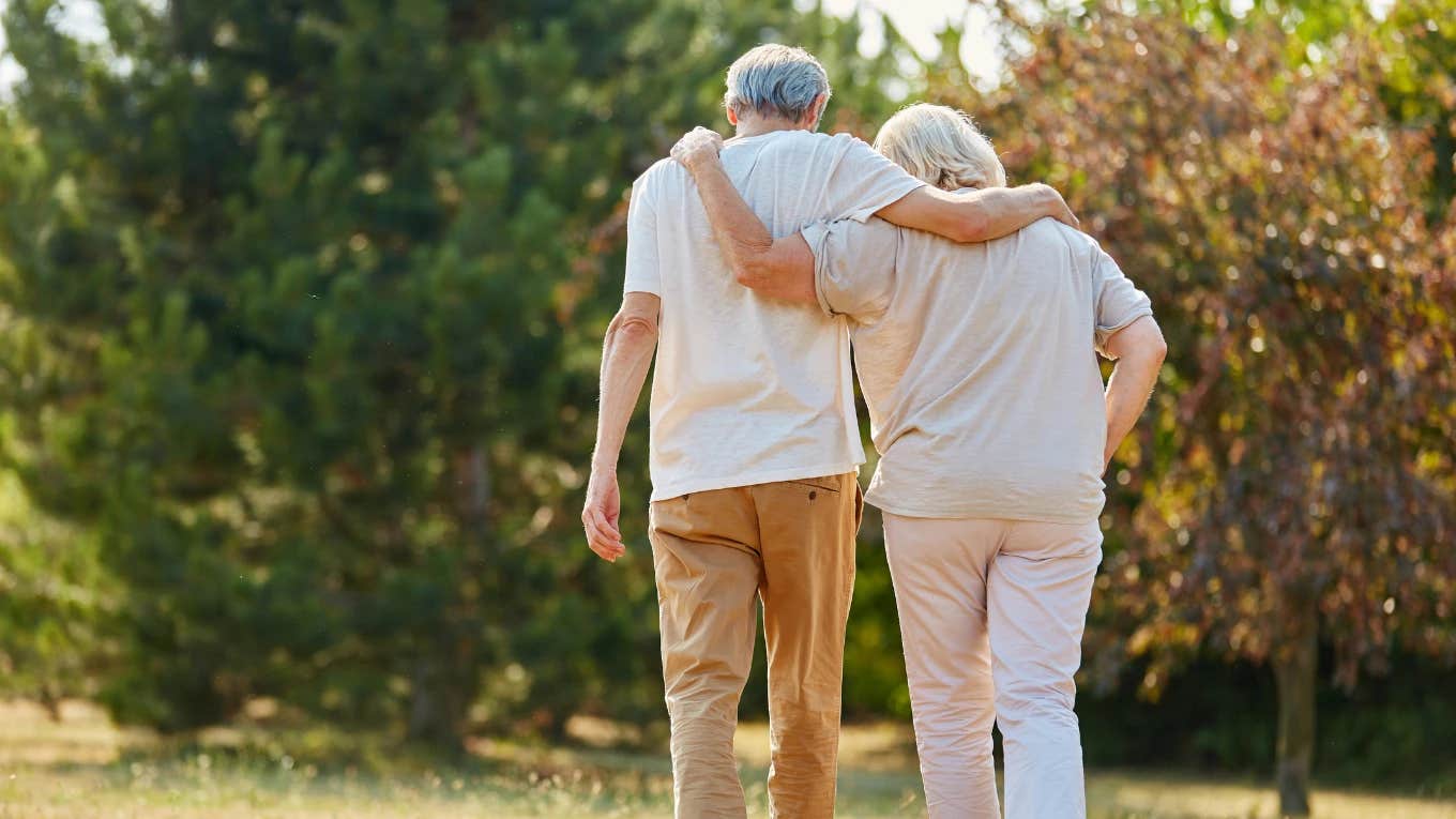 elderly couple walking together