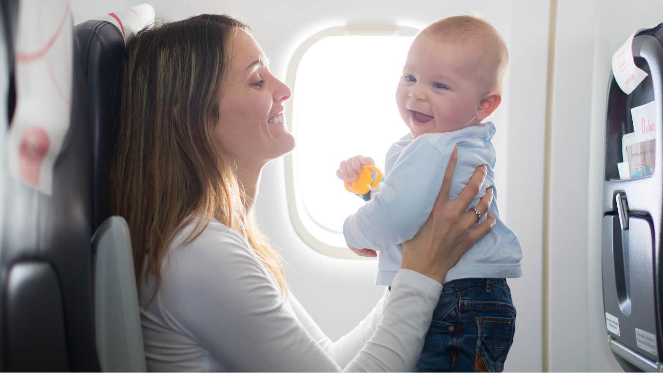 Mom's Video For How To Keep A Baby Happy On An Airplane Sparks Debate Mom holding her baby on an airplane