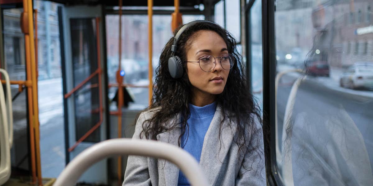 Woman sitting on public transportation