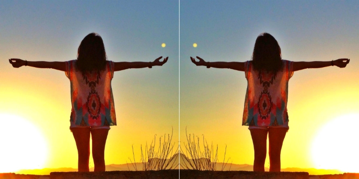 woman worshipping the sun