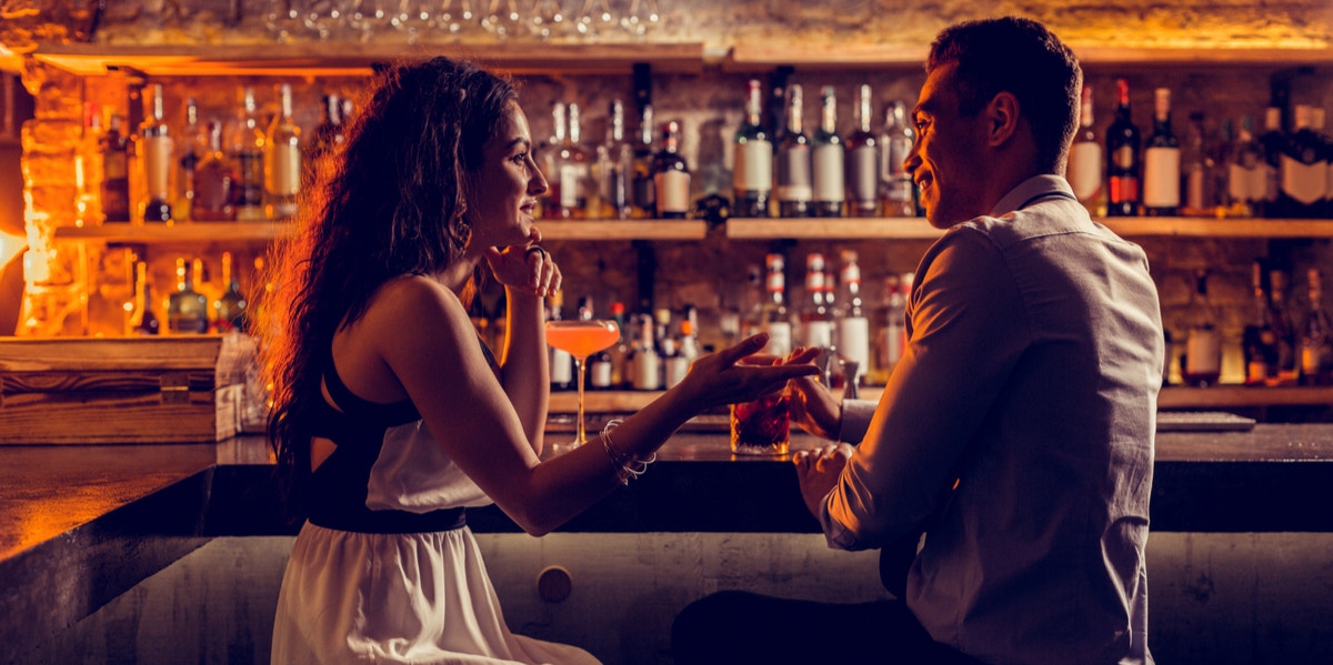 man and woman at bar