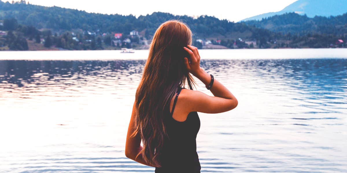woman looking at lake