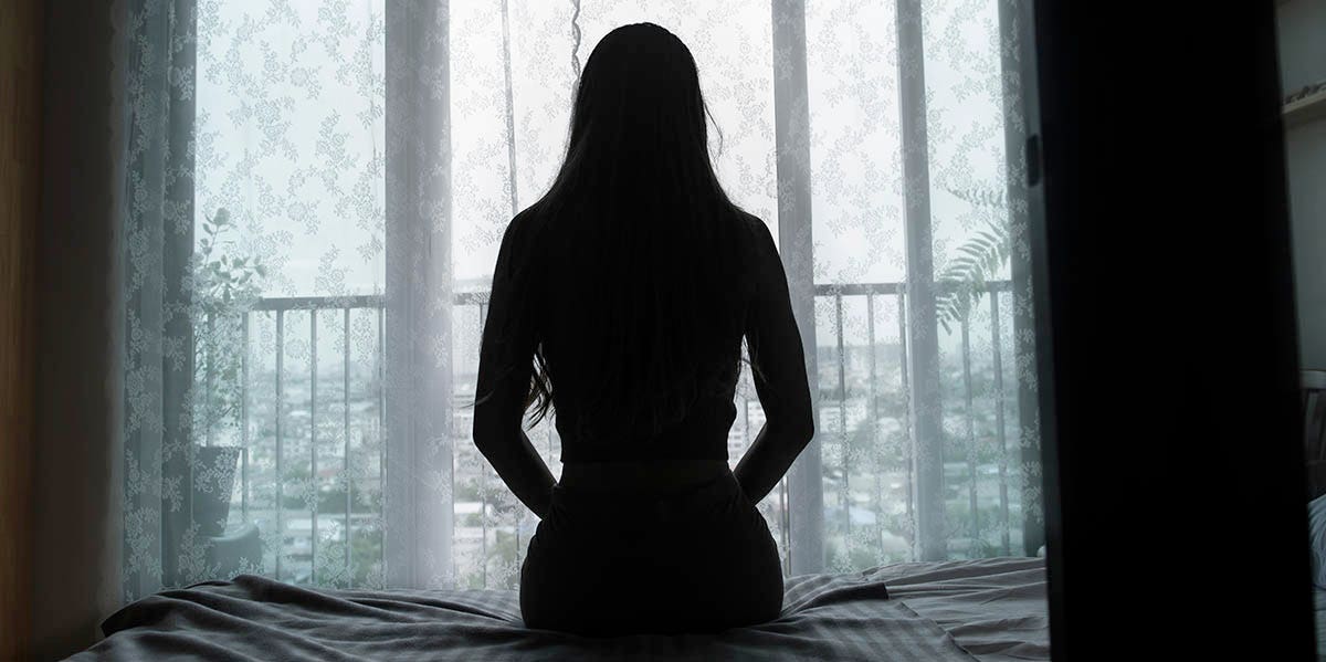 silhouette of a woman sitting