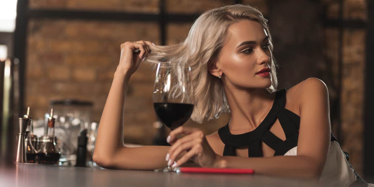 woman drinking wine thinking