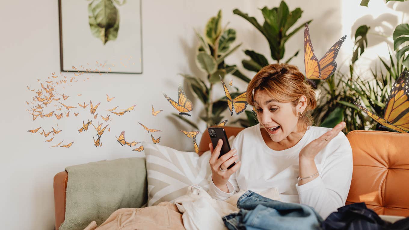Woman receiving a text and getting butterflies