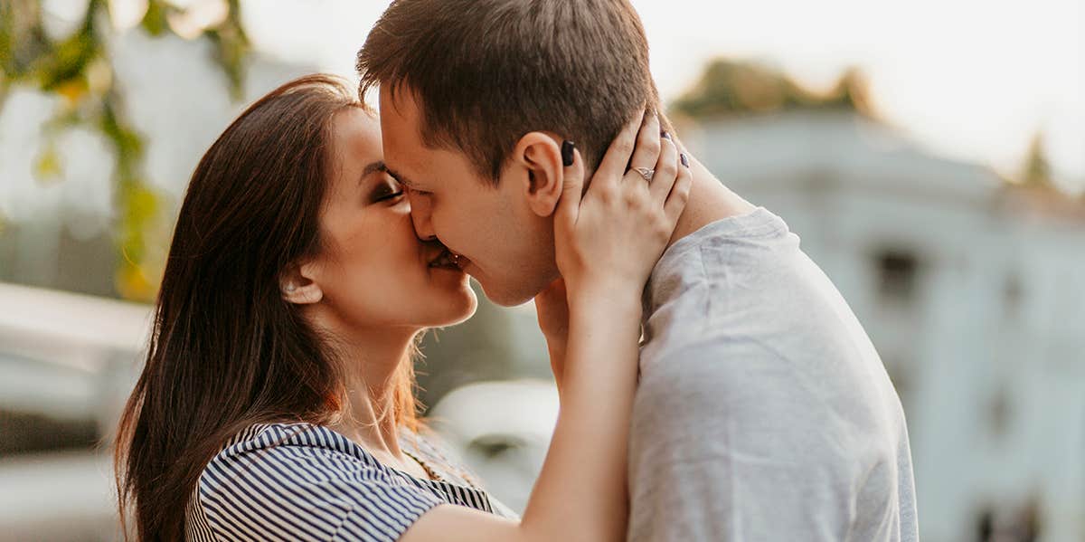 man and woman kissing