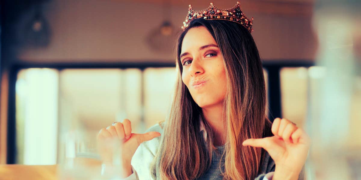 Signs You're Being Way Too Bossy bossy woman wearing a crown and pointing at herself