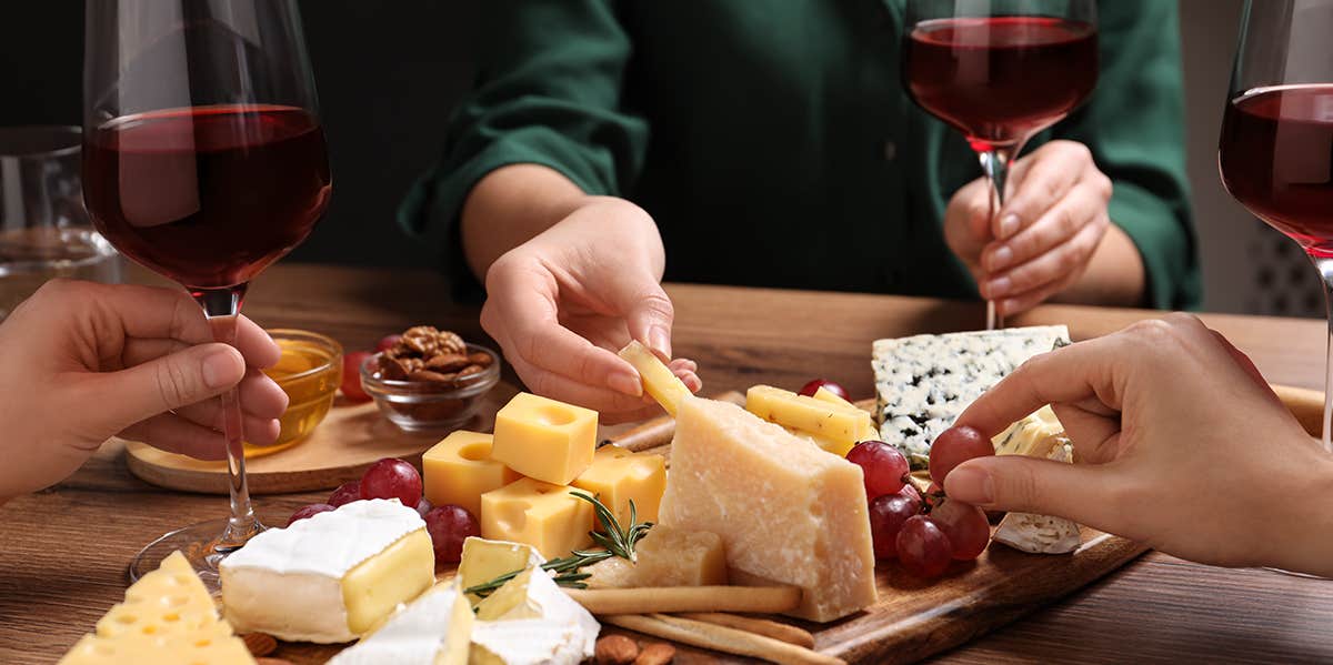 grabbing cheese from cheese board