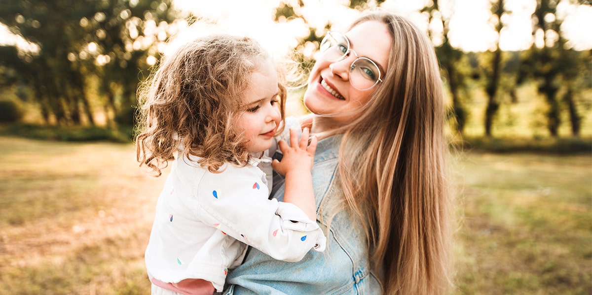 woman and daughter embracing