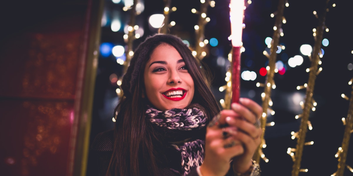 An Actual New Year’s Resolution woman holding sparkler