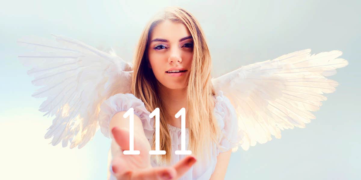 angel holding the number 111 in her hand