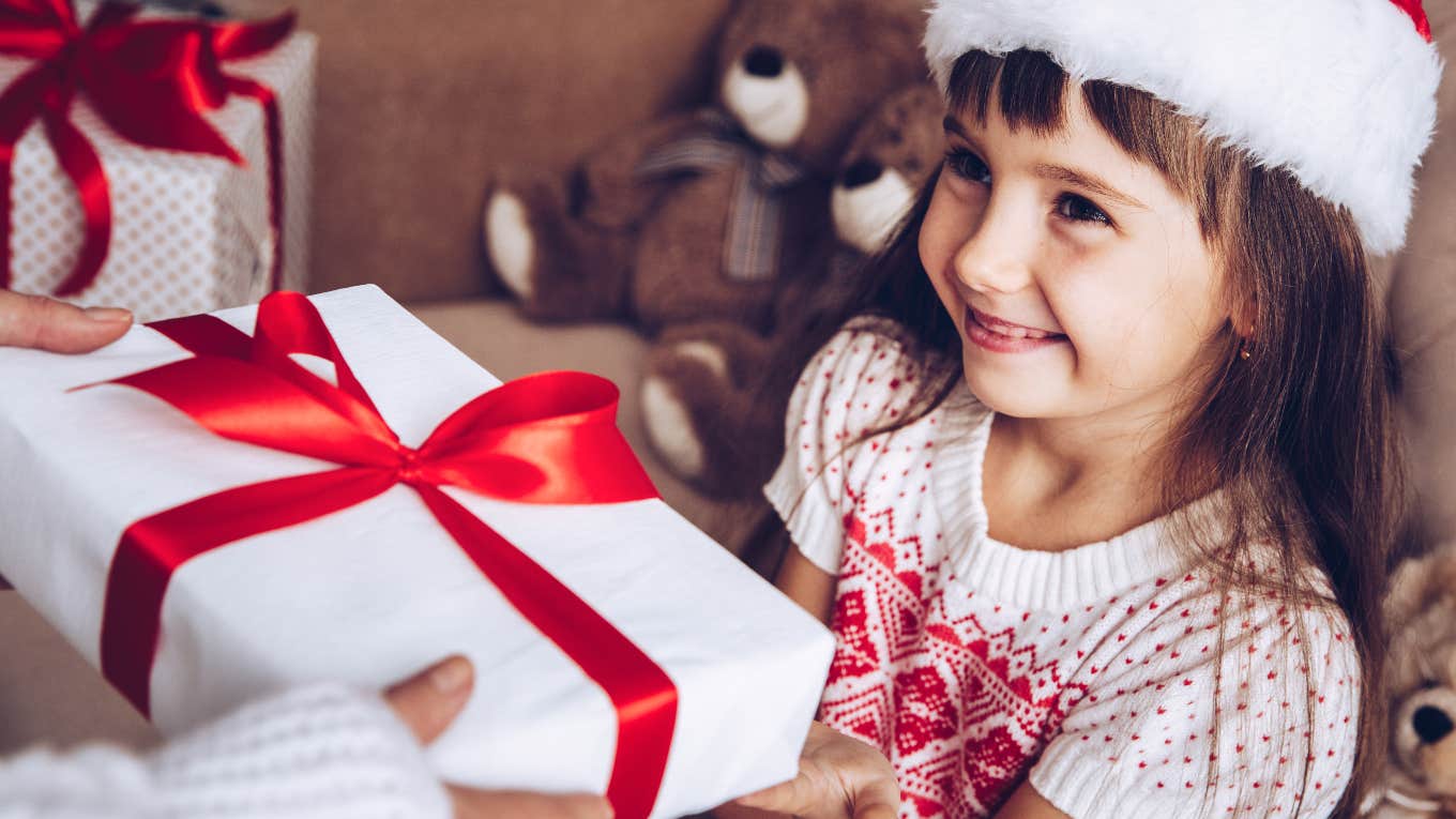 young girl receiving christmas gift