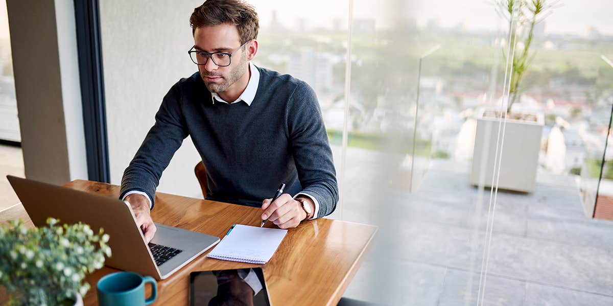 man studying on computer