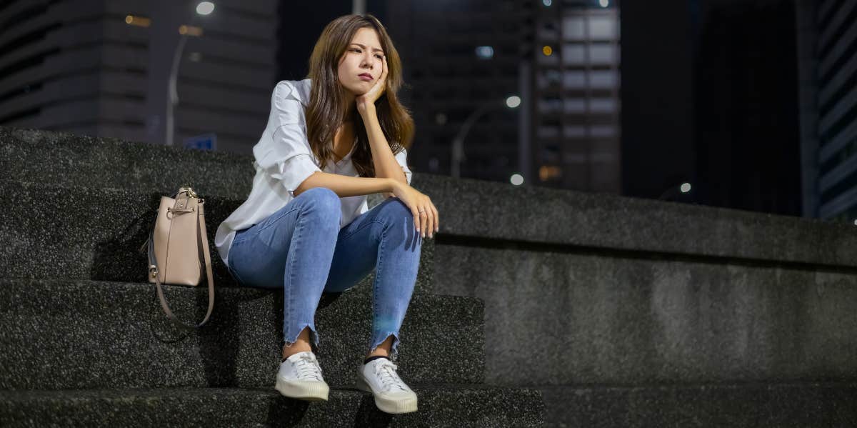 woman sitting on steps