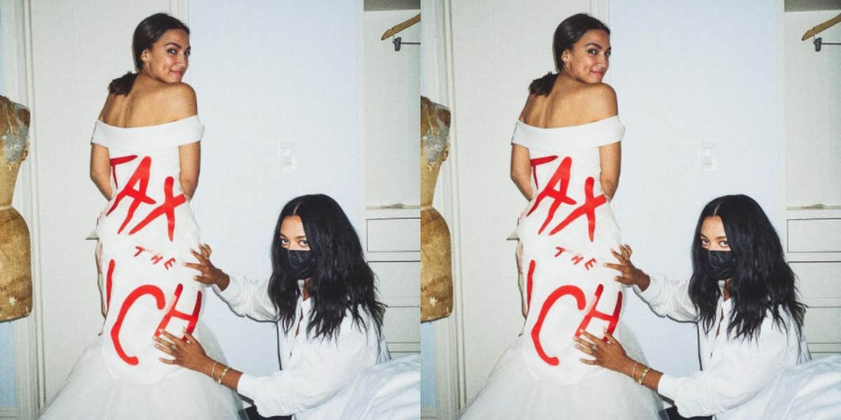 AOC’s ‘Tax The Rich’ Dress Was Perfectly On Brand For The Met Gala aoc tax the rich dress