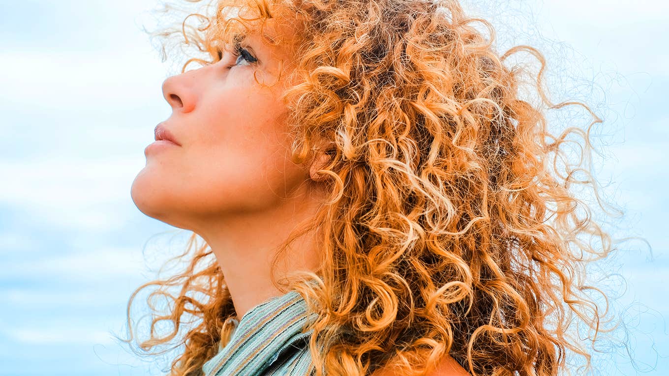 woman looking up at sky